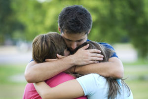 hugging family